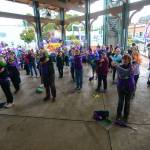 Participants in the Walk to End Alzheimer&rsquo;s stretch before the the walk in Port Angeles on Sunday. (Jesse Major/Peninsula Daily News)