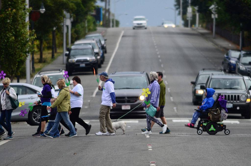 Participants in the Walk to End Alzheimer&rsquo;s walk through downtown Port Angeles on Sunday. (Jesse Major/Peninsula Daily News)