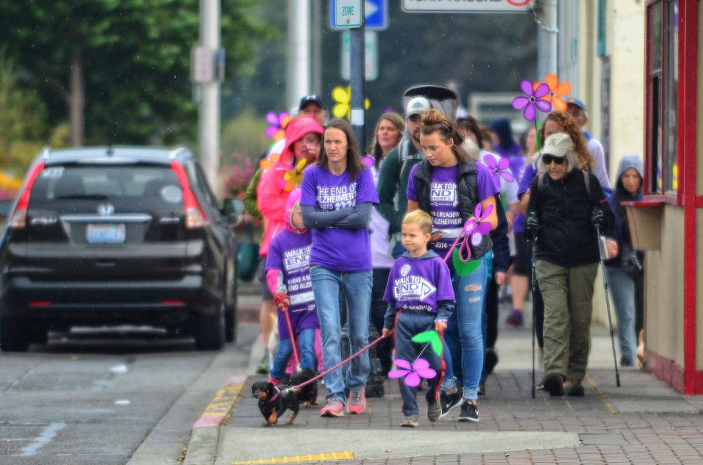 Participants in the Walk to End Alzheimer&rsquo;s walk through downtown Port Angeles on Sunday. (Jesse Major/Peninsula Daily News)