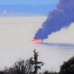 The boat fire as seen from Diamond Point at 6:30 p.m. Protection Island is in the foreground. (Stan McClain)