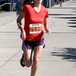 Mandy Miller of Port Angeles finishes the 10K run of the Big Hurt, the 6 mile run. She was a member of &ldquo;Kelp Whip,&rdquo; which came in 20th. (Dave Logan/for Peninsula Daily News)