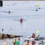 Kayakers pull into shore Saturday during the second leg of the Big Hurt. The kayakers had to get out of their boats and then go on a 30-mile bike ride. (Dave Logan/for Peninsula Daily News)