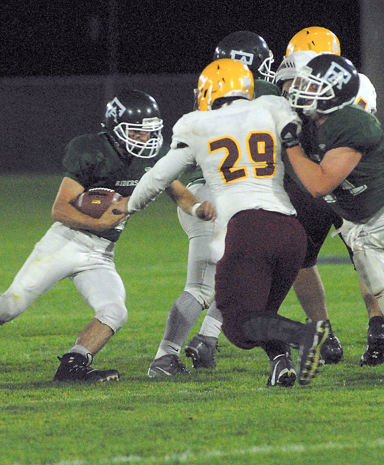 Keith Thorpe/Peninsula Daily News Port Angeles&rsquo; Jarret Burns, left, looks for an opening duing the first quarter on Friday night at home.