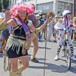 Kween Caption: Reigning Kinetic Kween and first year sculpture racer Lisa Doray of Port Townsend dances in the Uptown Street Fair with her team IPA. (Cydney McFarland/Peninsula Daily News)