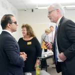 Lt. Gov. Cyrus Habib, left, chats with Sequim School District Superintendent Gary Neal on Wednesday. (Jesse Major/Peninsula Daily News)