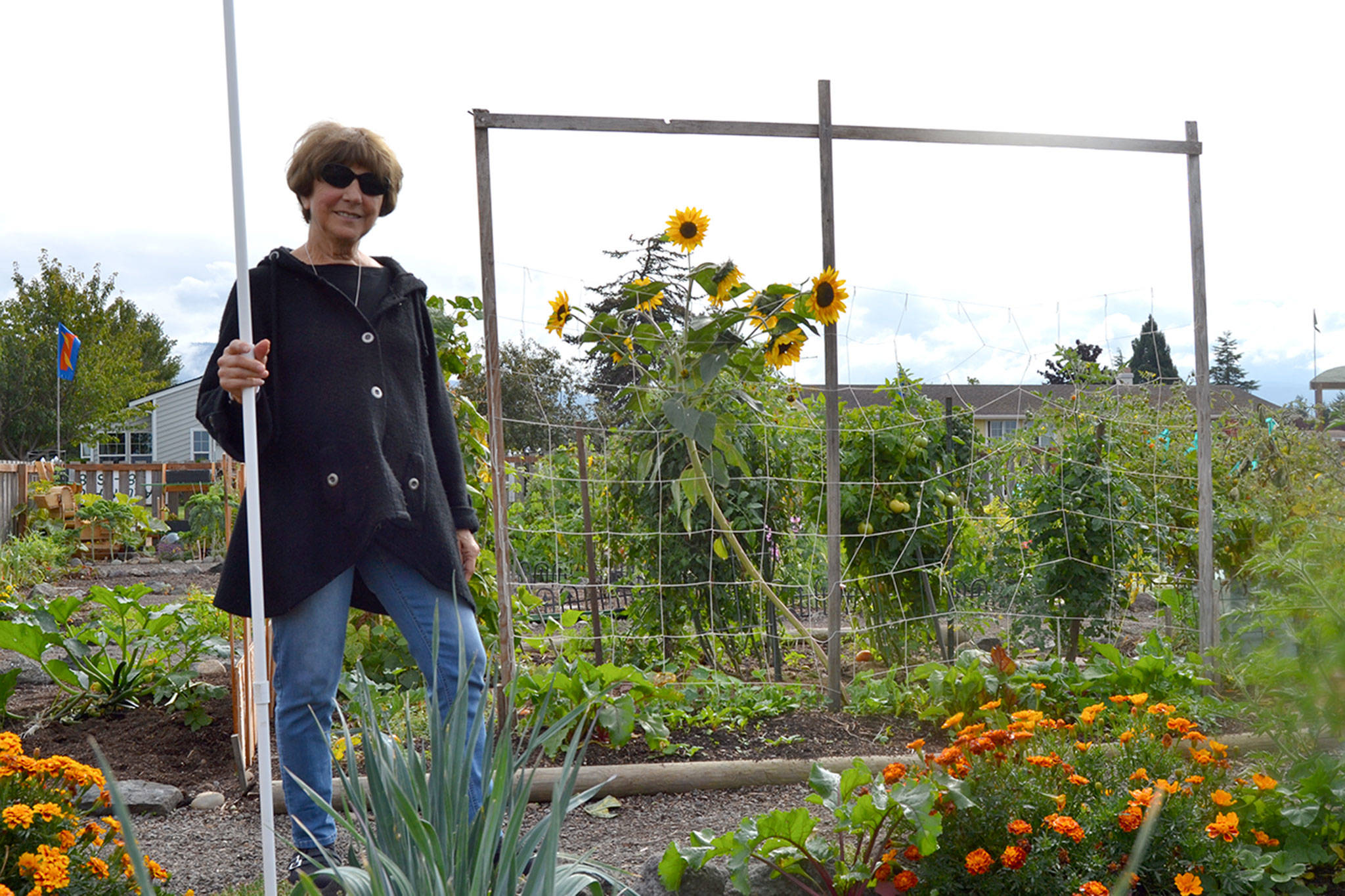 Matthew Nash/Olympic Peninsula News Group                                Liz Harper stands in the Fir Street Garden for the Community Organic Gardens of Sequim, which she helped start more than nine years ago. She&rsquo;s planning to move for health reasons but said she&rsquo;s proud of people&rsquo;s efforts. &ldquo;It&rsquo;s a true community garden,&rdquo; she said.