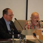 Sequim School District Board of Directors candidate Brian Kuh listens as his opponent Jon Kirshbaum speaks at a League of Women Voters forum last Thursday. (Erin Hawkins/Olympic Peninsula News Group)