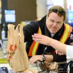 Ryan Brooke, who has Down syndrome, bags groceries at the Port Angeles Safeway on Lincoln Street in Port Angeles on Monday. The store was recently recognized by Clallam County for its efforts to hire people with disabilities and it has been nominated for a Governor&rsquo;s Award for the 11th time. (Jesse Major/Peninsula Daily News)