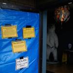The damaged door of Mister Buds retail marijuana shop in Port Angeles is seen Monday. (Rob Ollikainen/Peninsula Daily News)