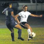 Sequim&rsquo;s Mary McAleer, right, controls the ball as North Kitsap&rsquo;s Alaina Marcotte defends on Tuesday night at Sequim High School.                                Keith Thorpe/Peninsula Daily News