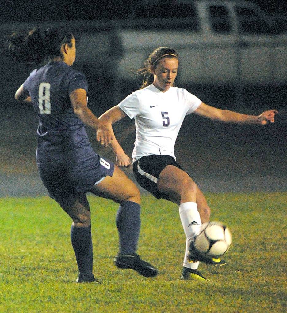 Sequim&rsquo;s Mary McAleer, right, controls the ball as North Kitsap&rsquo;s Alaina Marcotte defends on Tuesday night at Sequim High School.                                Keith Thorpe/Peninsula Daily News