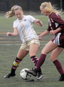 Keith Thorpe/Peninsula Daily News                                Peninsula&rsquo;s Kelly Kevershan, left, battles for the ball with Whatcom&rsquo;s Payton Lunde on Wednesday at Wally Sigmar Field.