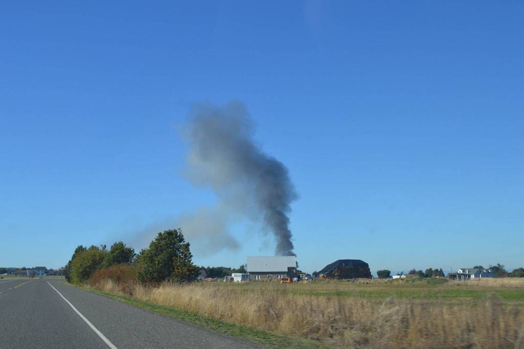 Smoke fills the sky from a house fire on Thornton Drive on Friday. (Matthew Nash/Olympic Peninsula News Group)