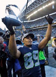 Seattle Seahawks' Doug Baldwin holds up George Halas Trophy after overtime of the NFL football NFC Championship game against the Green Bay Packers. (The Associated Press)