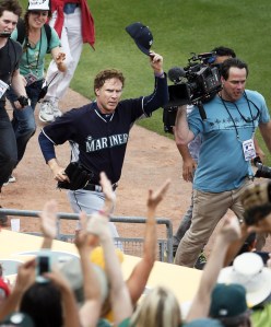 Actor Will Ferrell acknowledges the fans after playing second base for the Seattle Mariners during the second inning of a spring training baseball game against the Oakland Atletics today in Mesa