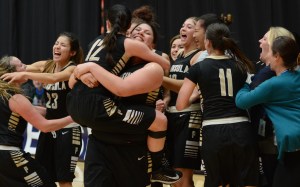 Peninsula's Gabi Fenumiai lifts teammate Madison Pilster (12) as the Pirates celebrate their 84-70 win over Umqua in the NWAC semifinals in Kennewick. (Rick Ross/Peninsula College)