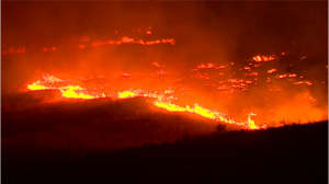 Flames race across a ridge near Twisp. The Associated Press