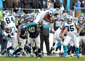 Carolina Panthers outside linebacker Thomas Davis (58) receives an on-side kick from the Seattle Seahawks during the second half of an NFL divisional playoff football game