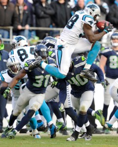 Carolina Panthers outside linebacker Thomas Davis (58) receives an on-side kick from the Seattle Seahawks during the second half of an NFL divisional playoff football game