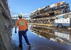 The former art deco ferry Kalakala looks as though a hurricane hit it on the port side as the vessel is dismantled in a Tacoma graving yard earlier this week. (McClatchy News Service)
