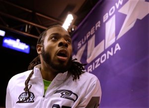 Seattle Seahawks' Richard Sherman answers questions during Media Day on Tuesday. (The Associated Press (Click on photo to enlarge))