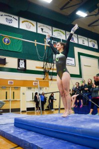 Port Angeles sophomore Maya Wharton finishes her uneven bars routine. Wharton placed 10th on the bars