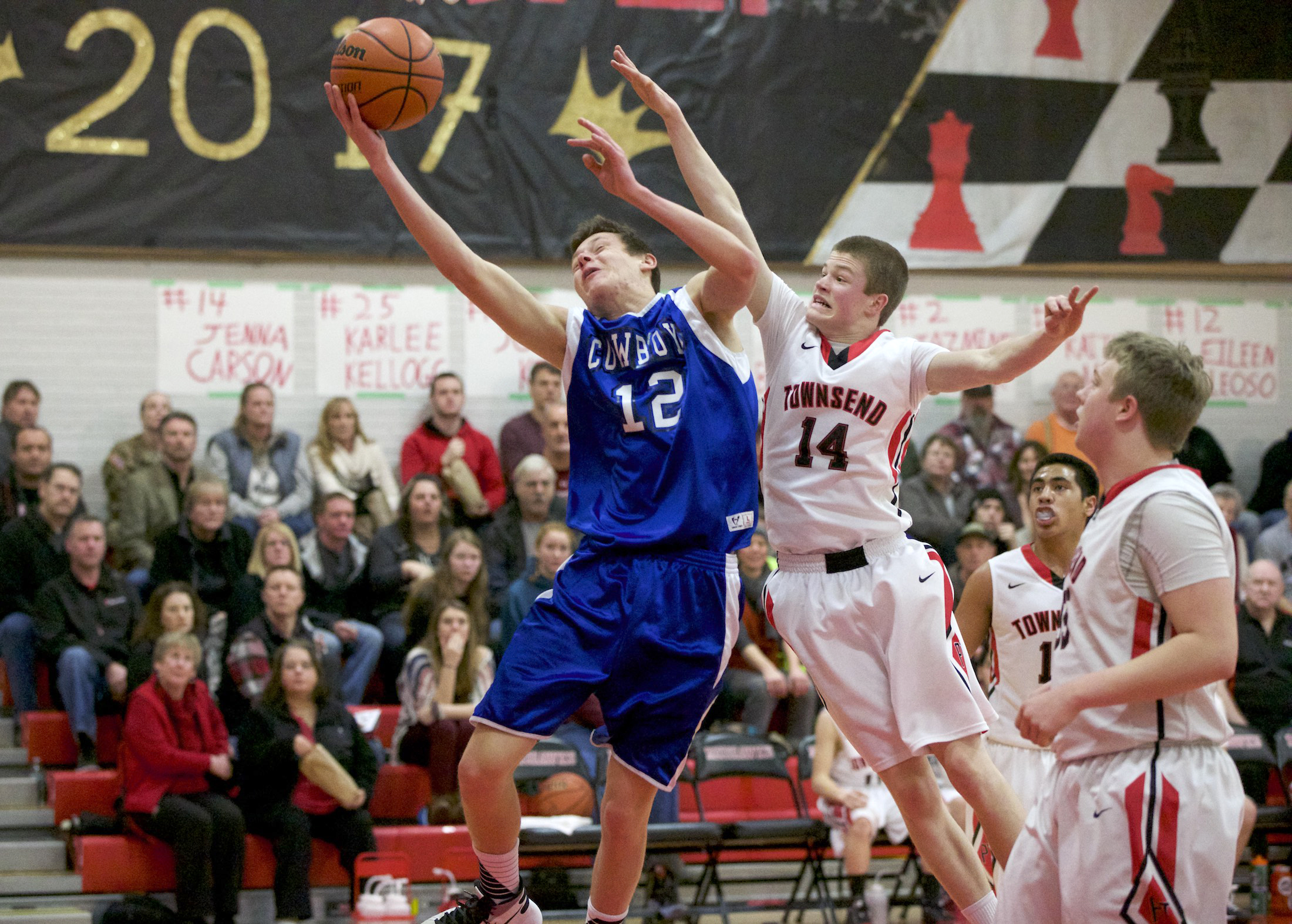 Chimacum's James Porter drives to the basket while defended by Port Townsend's Berkley Hill (14). (Steve Mullensky/for Peninsula Daily News)