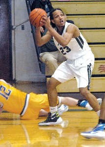 Port Angeles senior Lambros Rogers looks to make a pass during the Roughriders' game against Bremerton on Feb. 2. (Keith Thorpe/Peninsula Daily News)