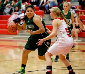 Port Angeles' Nizhoni Wheeler looks for a way around Port Townsend's Kaitlyn Meek during a game in Port Townsend earlier this season. Wheeler and the 10th-ranked Roughriders play ninth-ranked Anacortes in the 2A regionals today. (Steve Mullensky/for Peninsula Daily News)