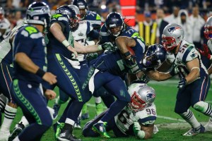 Seattle Seahawks running back Marshawn Lynch (24) gets tackled during the second half of Super Bowl XLIX last month. (The Associated Press)