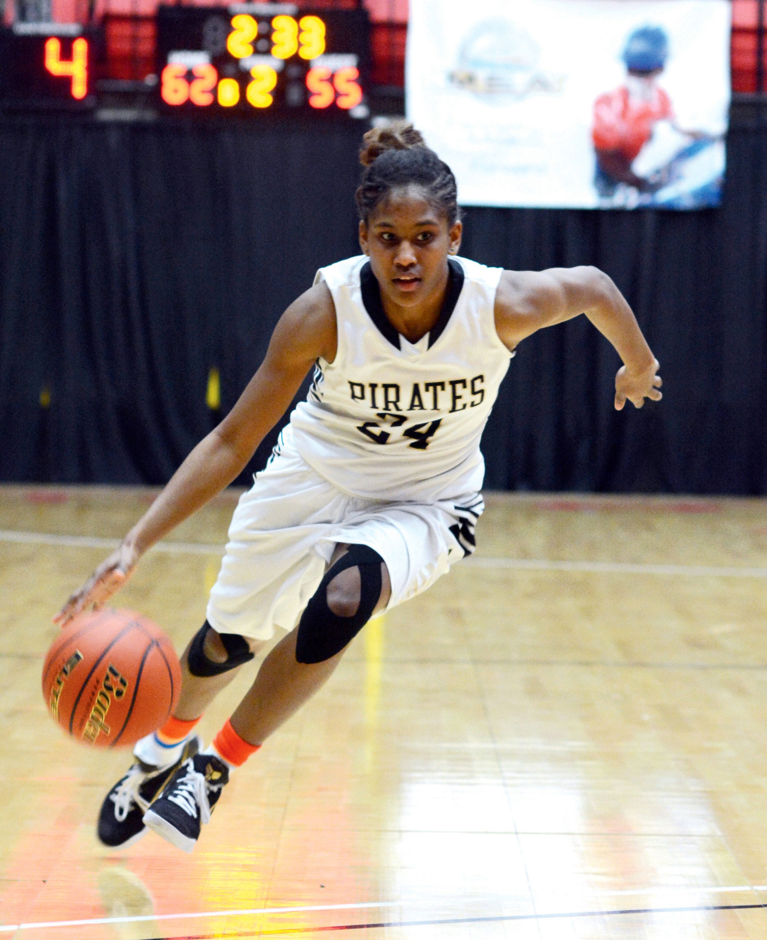 Peninsula point guard Imani Smith dribbles upcourt during the Pirates' 69-55 win in the NWAC tournament quarterfinals. Smith led Peninsula with 20 points. (Rick Ross/Peninsula College)