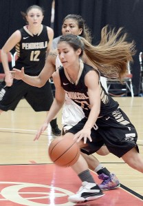 Peninsula's Miranda Schmillen (with ball) dribbles in the lane while covered by an Umpqua defender during Peninsula's 84-70 NWAC semifinal victory over the Riverhawks Monday at the Toyota Center in Kennewick. (Rick Ross/Peninsula College)