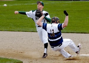 Port Angeles shortstop Ben Basden throws to first after forcing out Aberdeen's Jake Metke in the third inning at Civic Field. (Keith Thorpe/Peninsula Daily News)