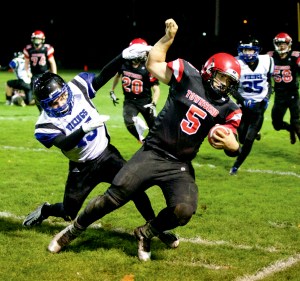 Port Townsend's David Sua gets pushed out of bounds after picking up a first down during the Redhawks' postseason victory over Bellevue Christian. In his only season starting at quarterback