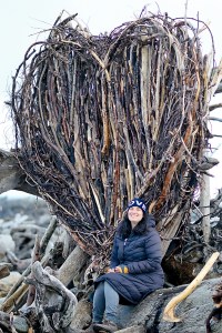 Sahrah Brown of Victoria has constructed a heart of driftwood on windswept Ediz Hook. (Diane Urbani de la Paz/Peninsula Daily News)
