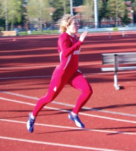 Port Angeles graduate Jolene Millsap runs for Olympic College at the Shotwell Invite. (Dan Dittmer/Olympic College)