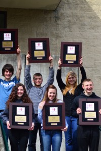 Members of Port Angeles High School's choirs display the gold awards brought home from the New York Heritage Festival