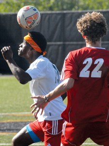 Port Townsend's Beshir Little heads the ball as Seattle Christian's Dalton Saggau looks on during the first half of their West Central District playoff game at Wally Sigmar Field at Peninsula College in Port Angeles. (Keith Thorpe/Peninsula Daily News)