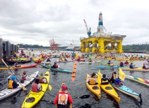 Activists in kayaks and other vessels
