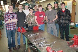 Port Angeles High School students who worked on a project to make fracture distractors used by orthopedic surgeons are pictured with instructor Justin Parker