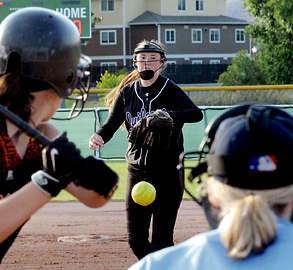Quilcene pitcher Bailey Kieffer delivers the pitch to Pomeroy's Esther Schuh. (Lonnie Archibald/for Peninsula Daily News)