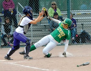 Sequim catcher Emily Copeland makes a force out of Lynden's Taylor Eshuis at home plate during the Class 2A state tournament in Selah. (Lonnie Archibald/for Peninsula Daily News)