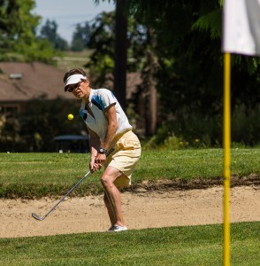 Marine Hirschfeld chips onto the 16th green during the Washington State Golf Association Senior Amateur at Cedars at Dungeness last week. Hirschfeld had a hole-in-one during the tournament. George Leinonen/for Peninsula Daily New