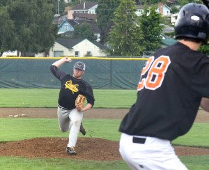 Lane Dotson of the Olympic Crosscutters pitches in a game earlier this season at Civic Field. (Dave Logan/for Peninsula Daily News)