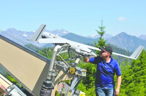 InSitu operator Joseph Cooper prepares the ScanEagle drone for launch to surveil the Paradise Fire in Olympic National Park last week. InSitu