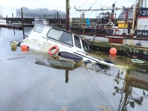 This 50-foot motor cruiser was found partially submerged Monday in the Quileute Marina. Senior Chief Cory Wadley