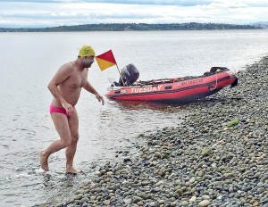 Andrew Malinak finishes his swim around Bainbridge Island on Aug 8. Melissa Nordquist