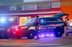 Pasco police officers investigate the scene of the shooting of Antonio Zambrano-Montes