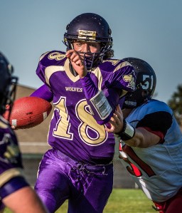 Sequim quarterback Nick Faunce eyes the goal line as he breaks away from Coupeville linebacker Julian Welling and scores on a 13-yard run. George Leinonen/for Peninsula Daily News