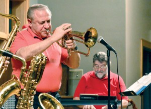 Joey Lazzaro blows the trumpet while Jim Rosand plays keyboards in the Cats Meow